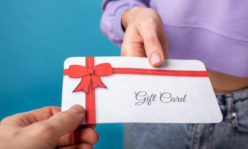 beautiful-gift-voucher-with-hand_23-2149243880